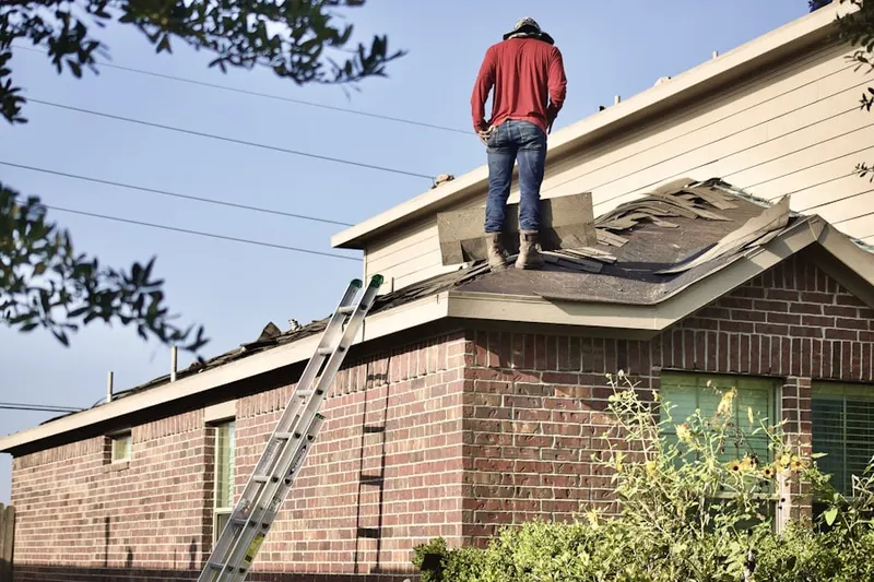 Professional roofer working on a residential roof in Powder Springs Chase